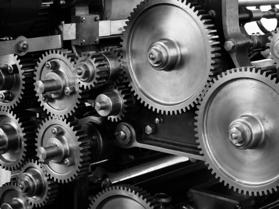 Close-up of interlocking gears on an industrial machine
